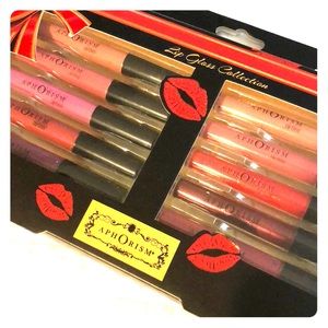 Never opened APHORISM lip gloss collection